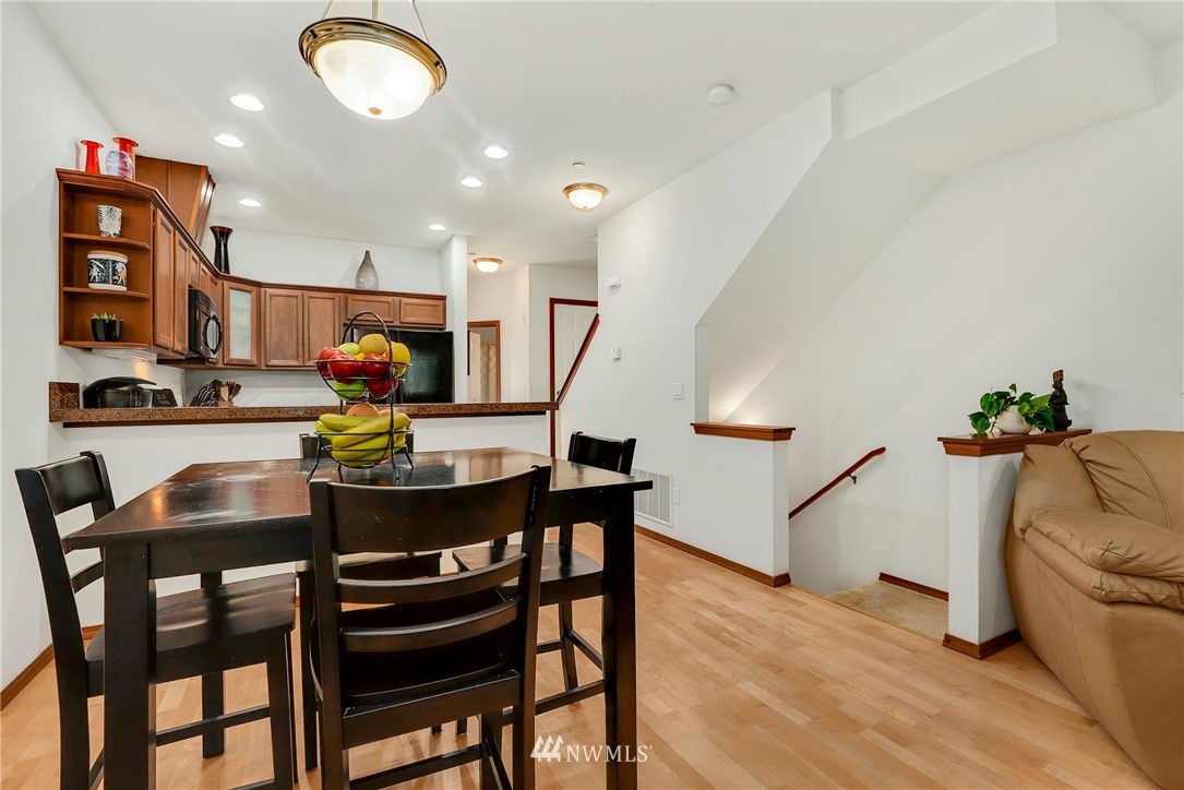 21351 11th Drive Southeast Bothell, WA 98021 - Photo 10 of 33 a dining room with furniture and wooden floor