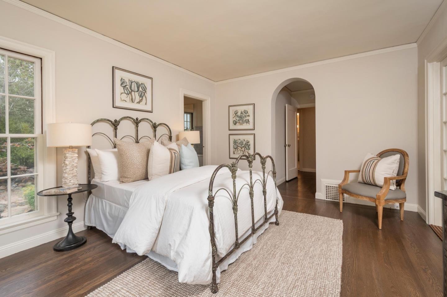 900 Link Road Hillsborough, CA 94010 - Photo 36 of 52 a spacious bedroom with a bed and a table in it