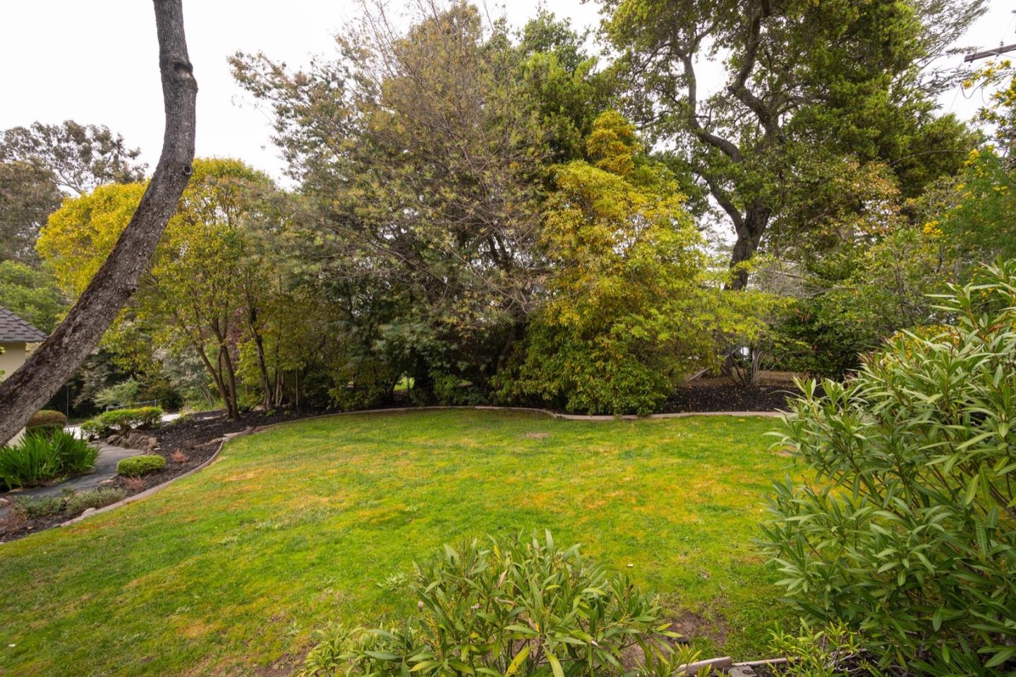 900 Link Road Hillsborough, CA 94010 - Photo 42 of 52 a view of a yard and basketball court