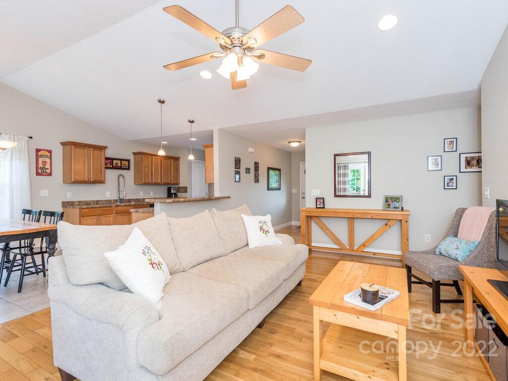 243 Scarlett Ridge Drive Marshall, NC 28753 - Photo 11 of 36 a living room with furniture and kitchen view
