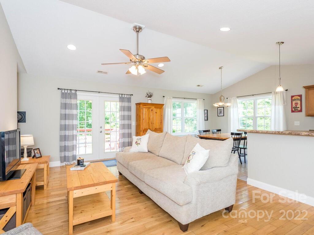 243 Scarlett Ridge Drive Marshall, NC 28753 - Photo 12 of 36 a living room with furniture ceiling fan and a window