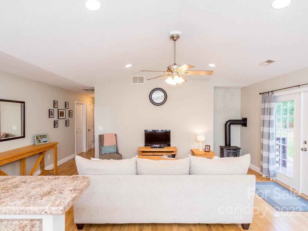 243 Scarlett Ridge Drive Marshall, NC 28753 - Photo 14 of 36 a living room with furniture and wooden floor
