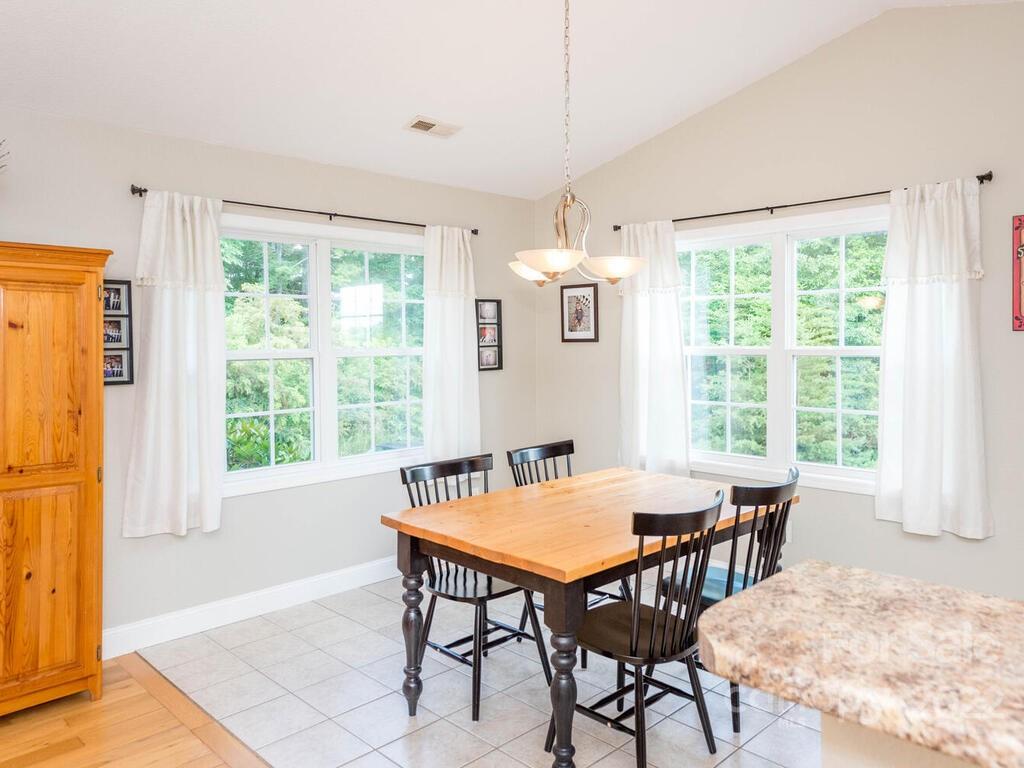 243 Scarlett Ridge Drive Marshall, NC 28753 - Photo 15 of 36 a view of a dining room with furniture window and outside view