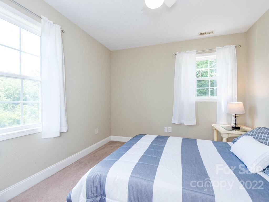 243 Scarlett Ridge Drive Marshall, NC 28753 - Photo 26 of 36 a bedroom with a bed and a window