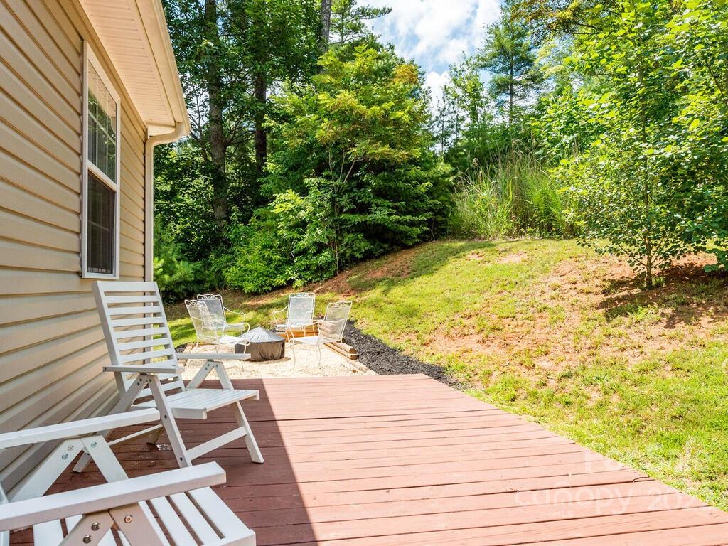 243 Scarlett Ridge Drive Marshall, NC 28753 - Photo 36 of 36 a view of backyard with swimming pool and seating space