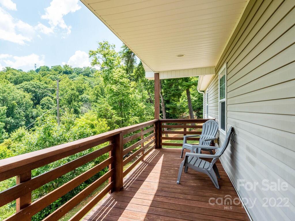 243 Scarlett Ridge Drive Marshall, NC 28753 - Photo 5 of 36 a view of two chairs in a balcony