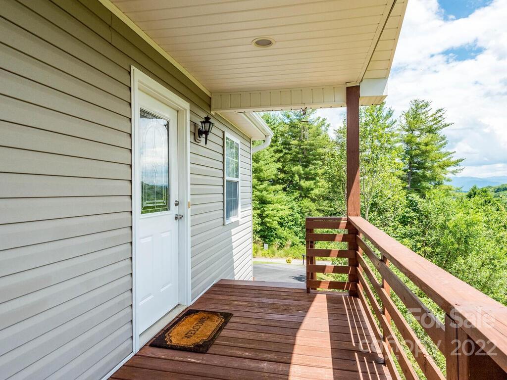 243 Scarlett Ridge Drive Marshall, NC 28753 - Photo 7 of 36 a porch with seating space