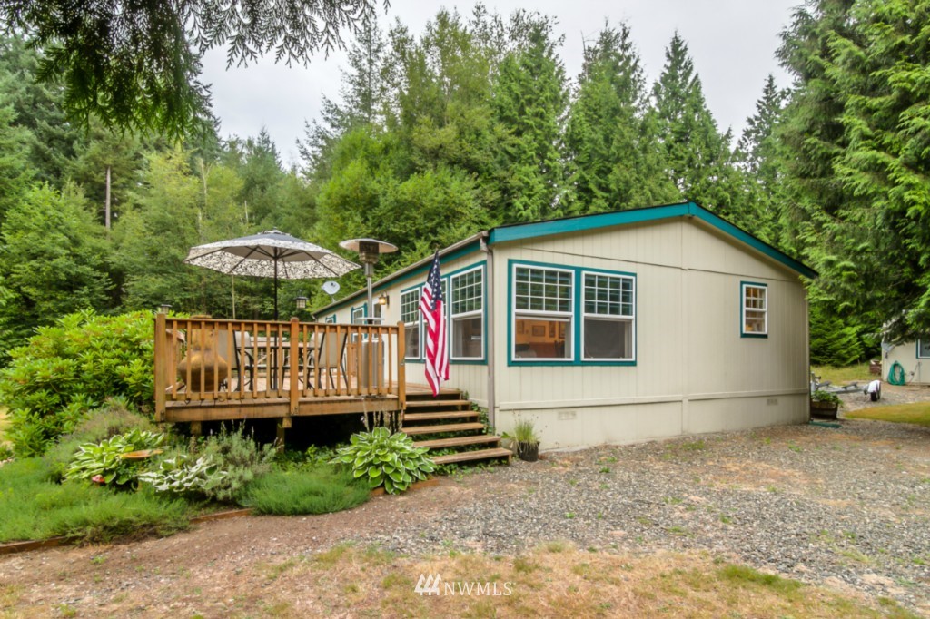 3554 Loomis Trail Road Blaine, WA 98230 - Photo 2 of 23 a backyard of a house with wooden deck and barbeque oven