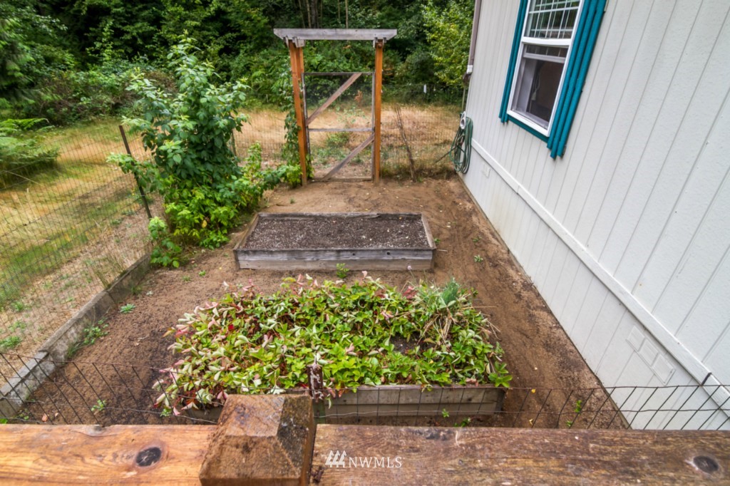 3554 Loomis Trail Road Blaine, WA 98230 - Photo 17 of 23 a view of a backyard with wooden fence