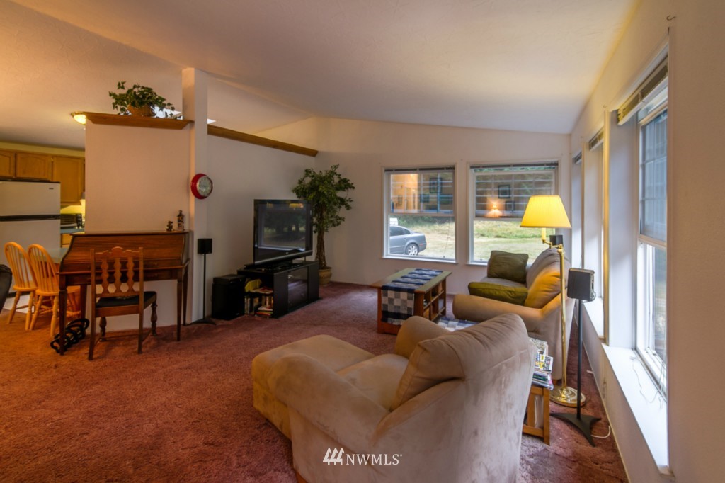 3554 Loomis Trail Road Blaine, WA 98230 - Photo 5 of 23 a living room with furniture and a flat screen tv