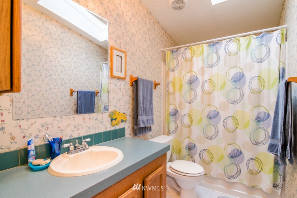 3554 Loomis Trail Road Blaine, WA 98230 - Photo 10 of 23 a bathroom with a sink toilet and a mirror