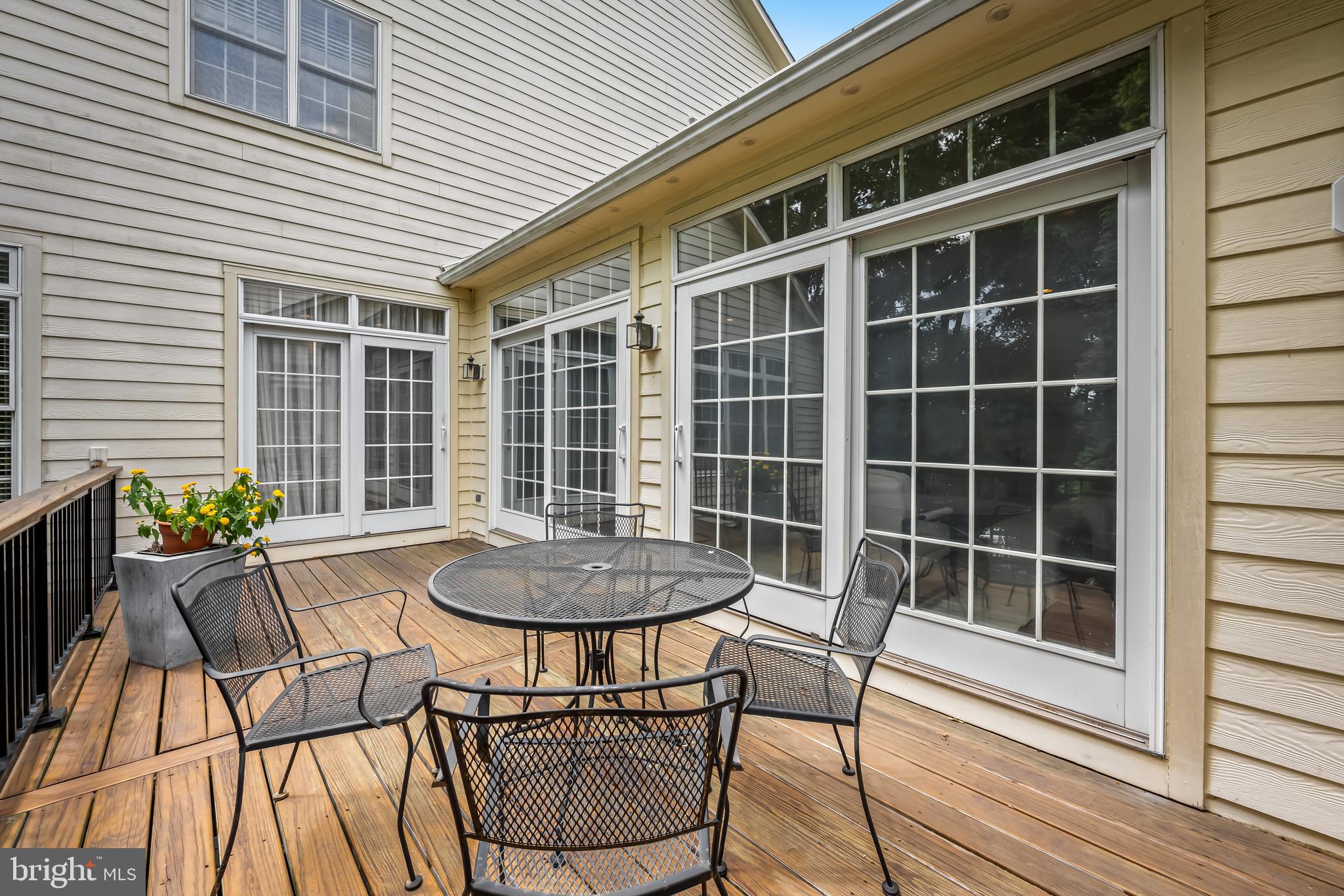 24 Roland Green, Unit 12 Baltimore, MD 21210 - Photo 45 of 53 a table and chairs in a patio