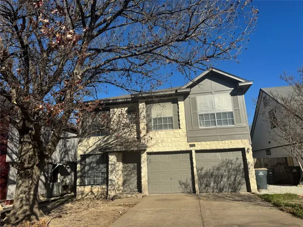 a view of a house with a tree