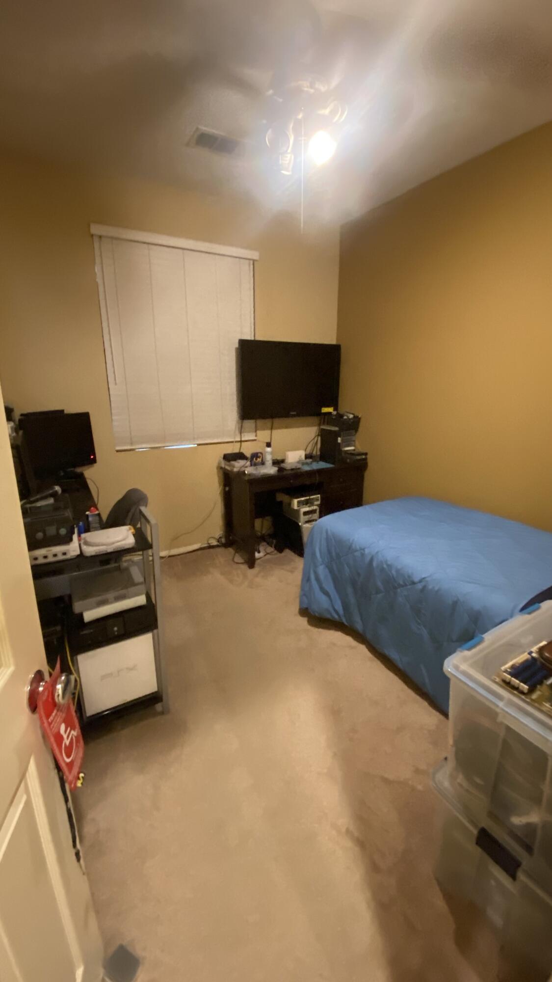 37894 Medway Street Indio, CA 92203 - Photo 13 of 27 a bedroom with bed and a flat screen tv