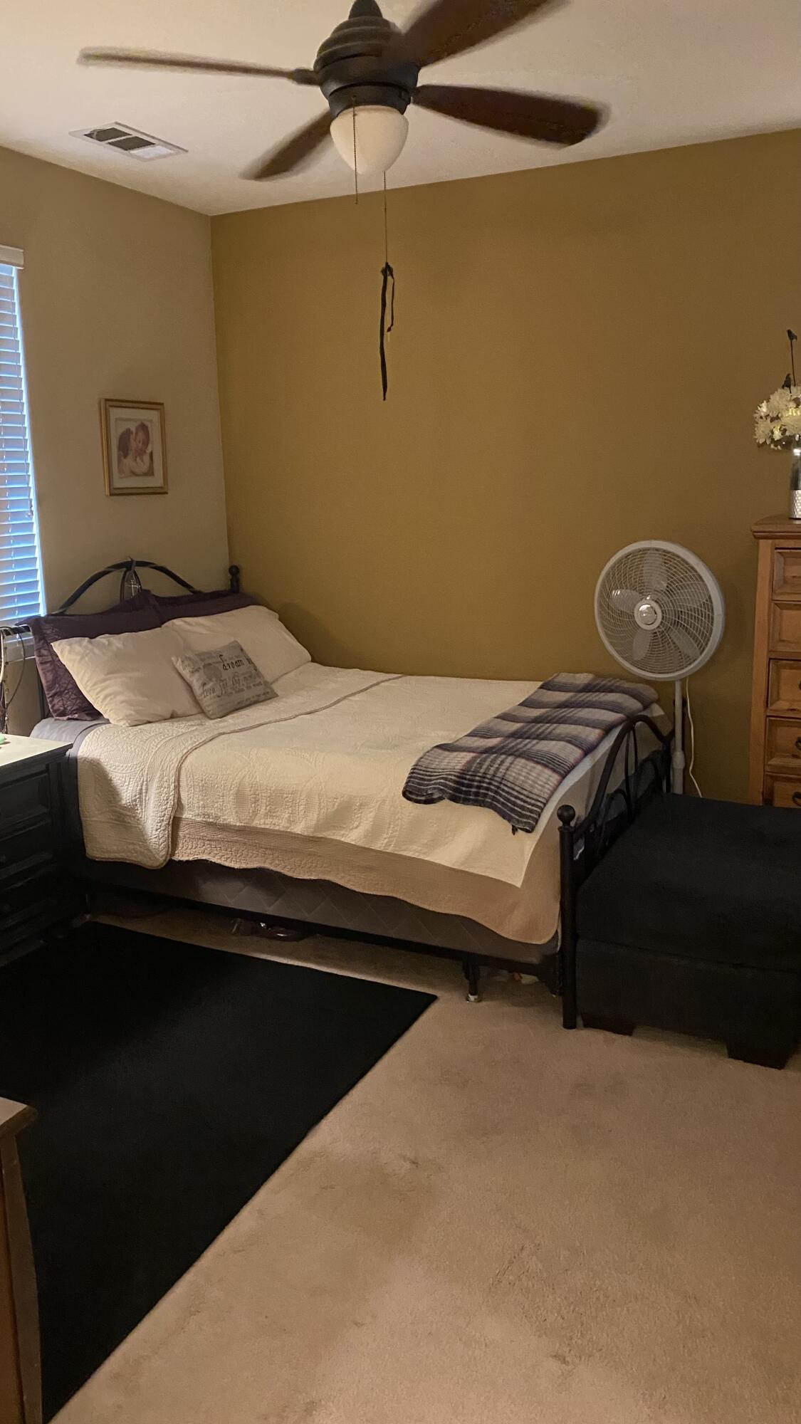 37894 Medway Street Indio, CA 92203 - Photo 15 of 27 a bedroom with a bed and cabinets