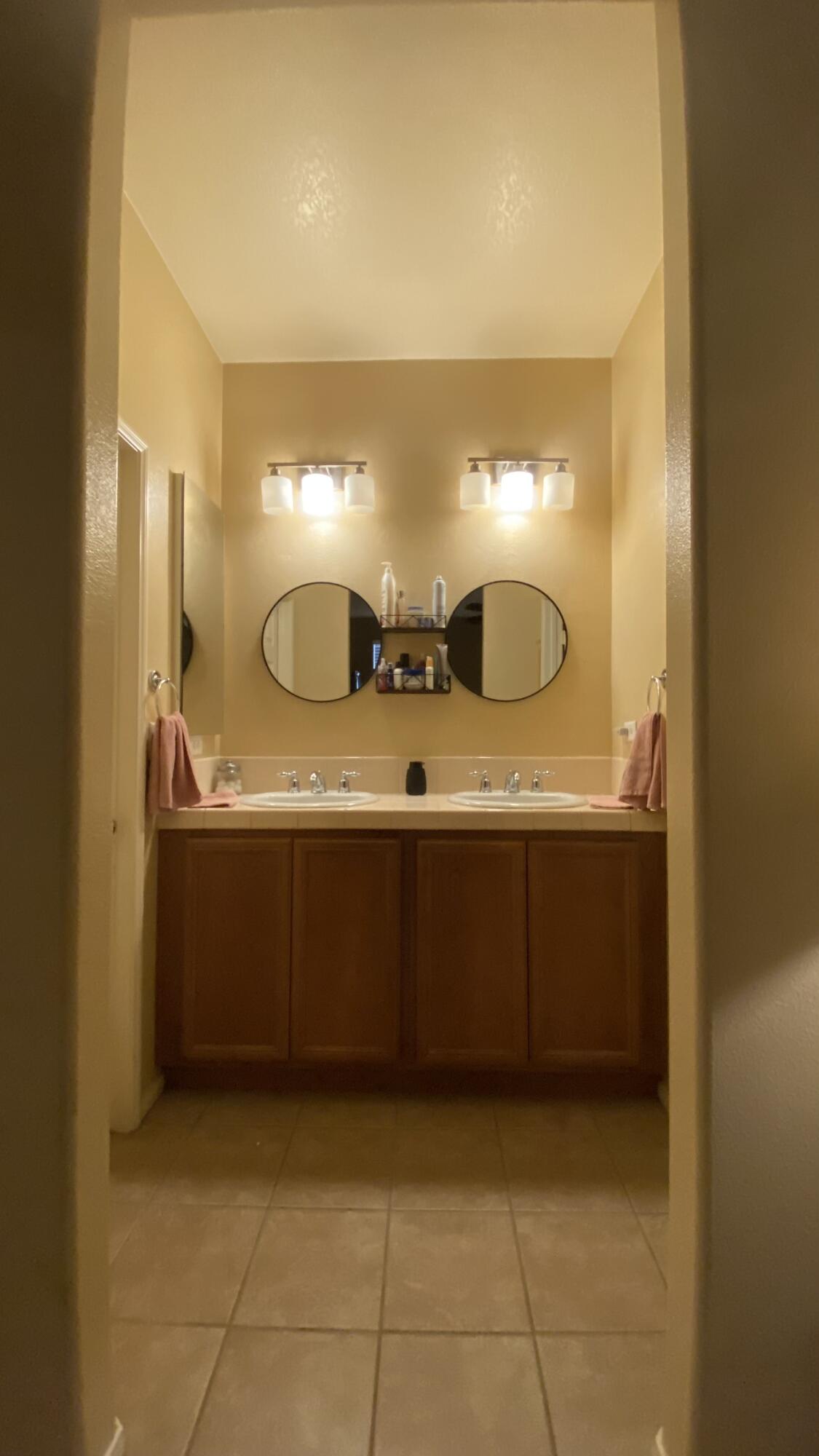 37894 Medway Street Indio, CA 92203 - Photo 21 of 27 a bathroom with a sink and a mirror