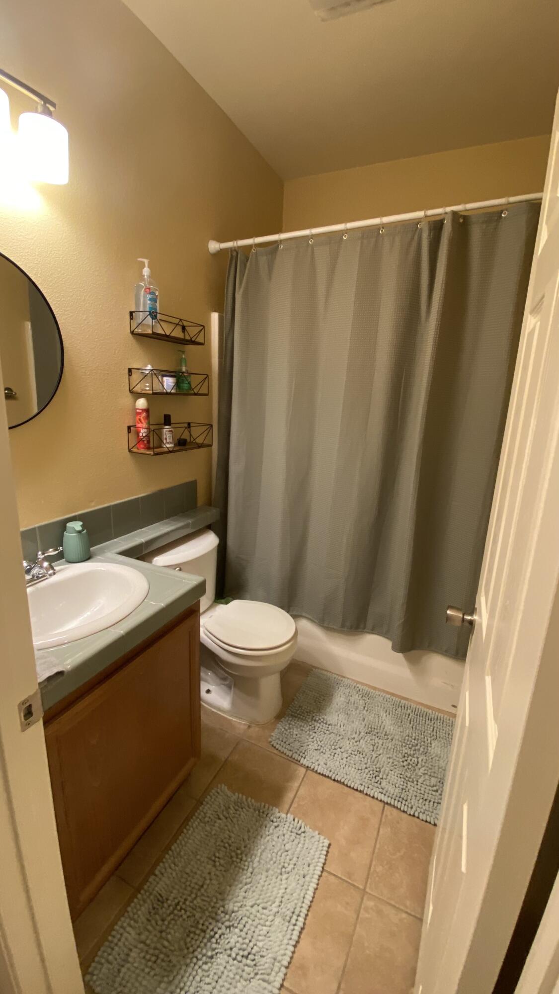 37894 Medway Street Indio, CA 92203 - Photo 23 of 27 a bathroom with a sink and a mirror