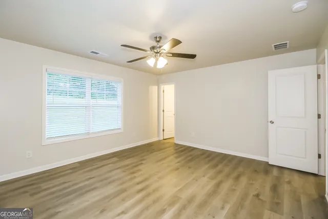 a view of an empty room with a window