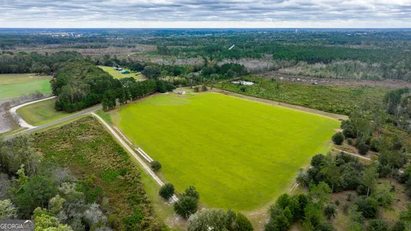 a view of a lake with a yard