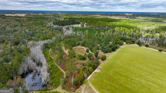 a view of a swimming pool from a yard