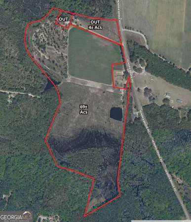 a view of a field with an ocean view