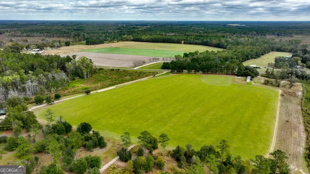 a view of a lake with a yard