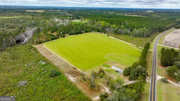 a view of a lake with a big yard