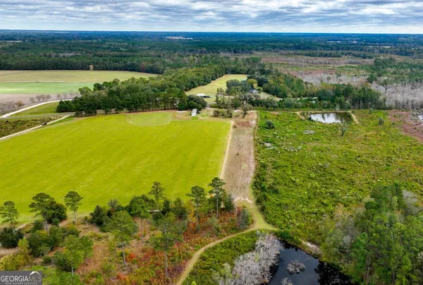 a view of a lake with a yard