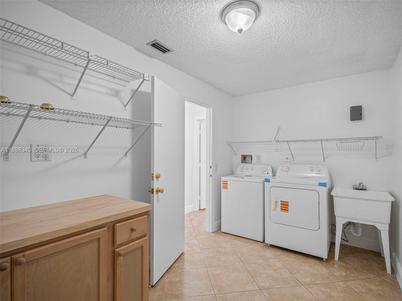 15531 Southwest 54th Terrace Miami, FL 33185 - Photo 11 of 61 a utility room with dryer and washer