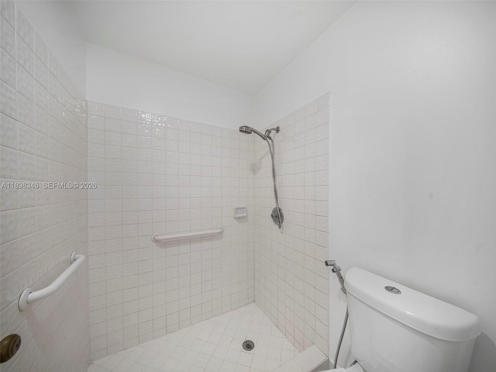 15531 Southwest 54th Terrace Miami, FL 33185 - Photo 13 of 61 a bathroom with a shower a toilet and sink