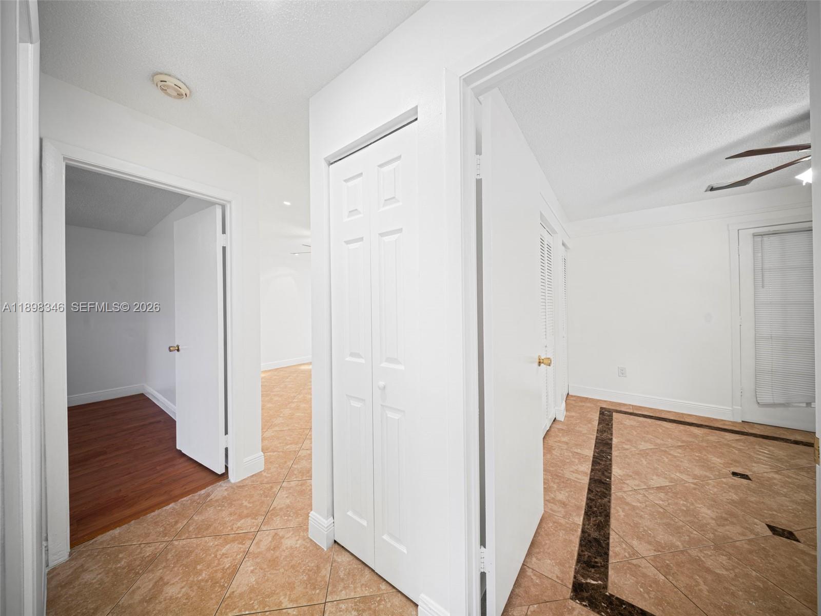 15531 Southwest 54th Terrace Miami, FL 33185 - Photo 20 of 61 a view of a hallway with wooden floor and entryway