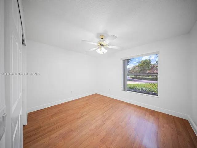 a view of kitchen with stainless steel appliances granite countertop a refrigerator and a sink
