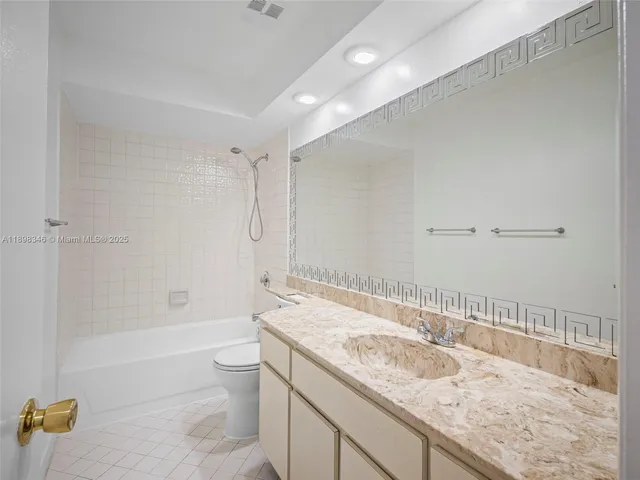 a kitchen with stainless steel appliances granite countertop wooden cabinets a sink dishwasher stove and granite countertops with cabinets