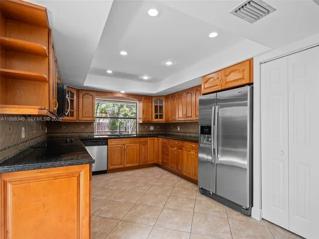 a view of a park with large trees