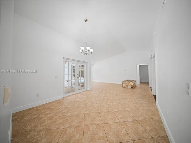 a view of a house with pool and chairs
