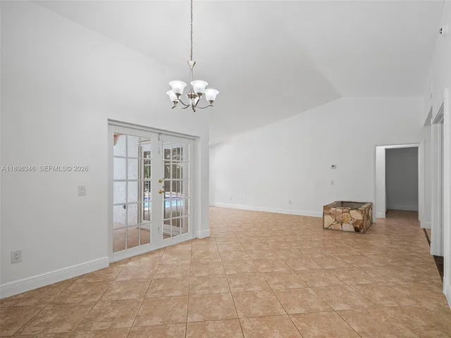 a view of a backyard with swimming pool