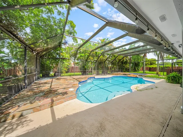 a view of outdoor space with deck and yard