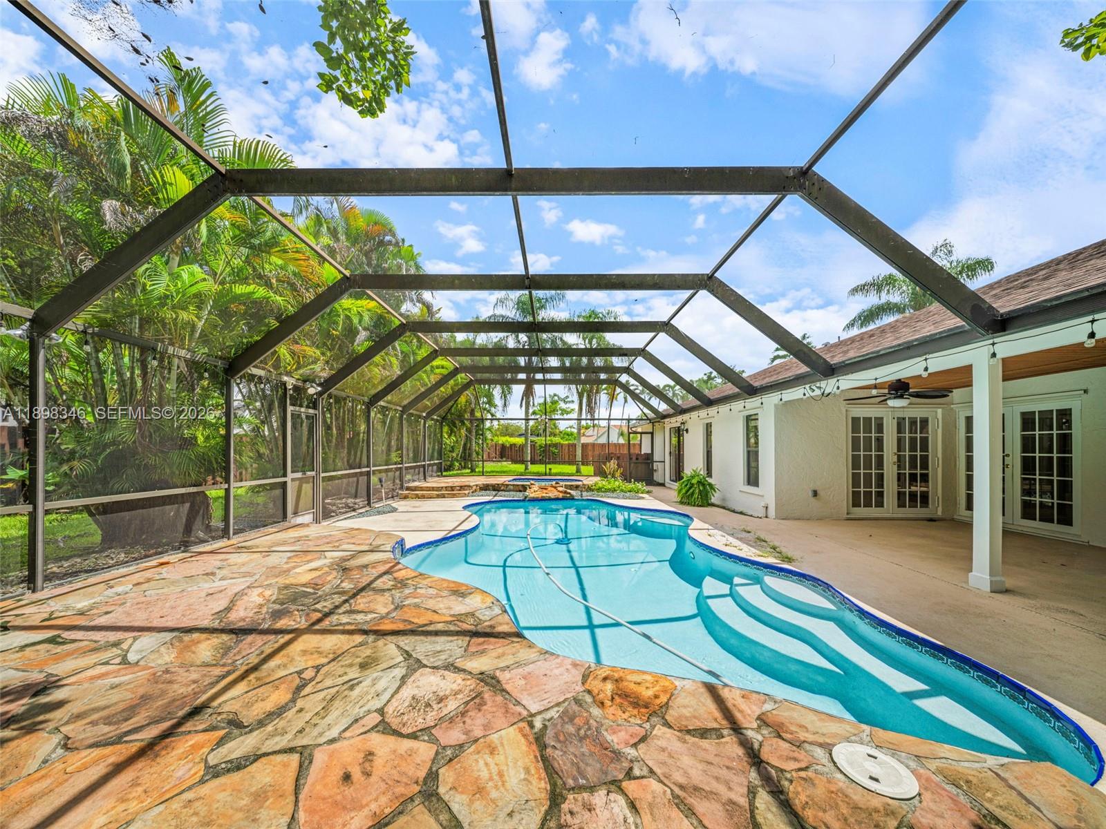 15531 Southwest 54th Terrace Miami, FL 33185 - Photo 39 of 61 a swimming pool with an outdoor seating and yard