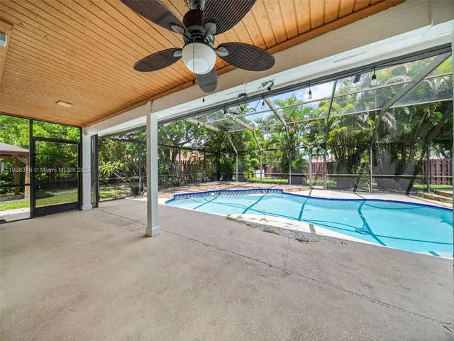 a view of a yard with a tree