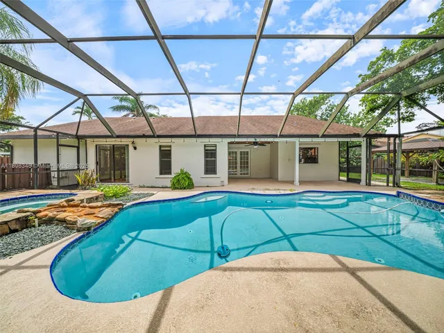 a house with palm tree in front of it