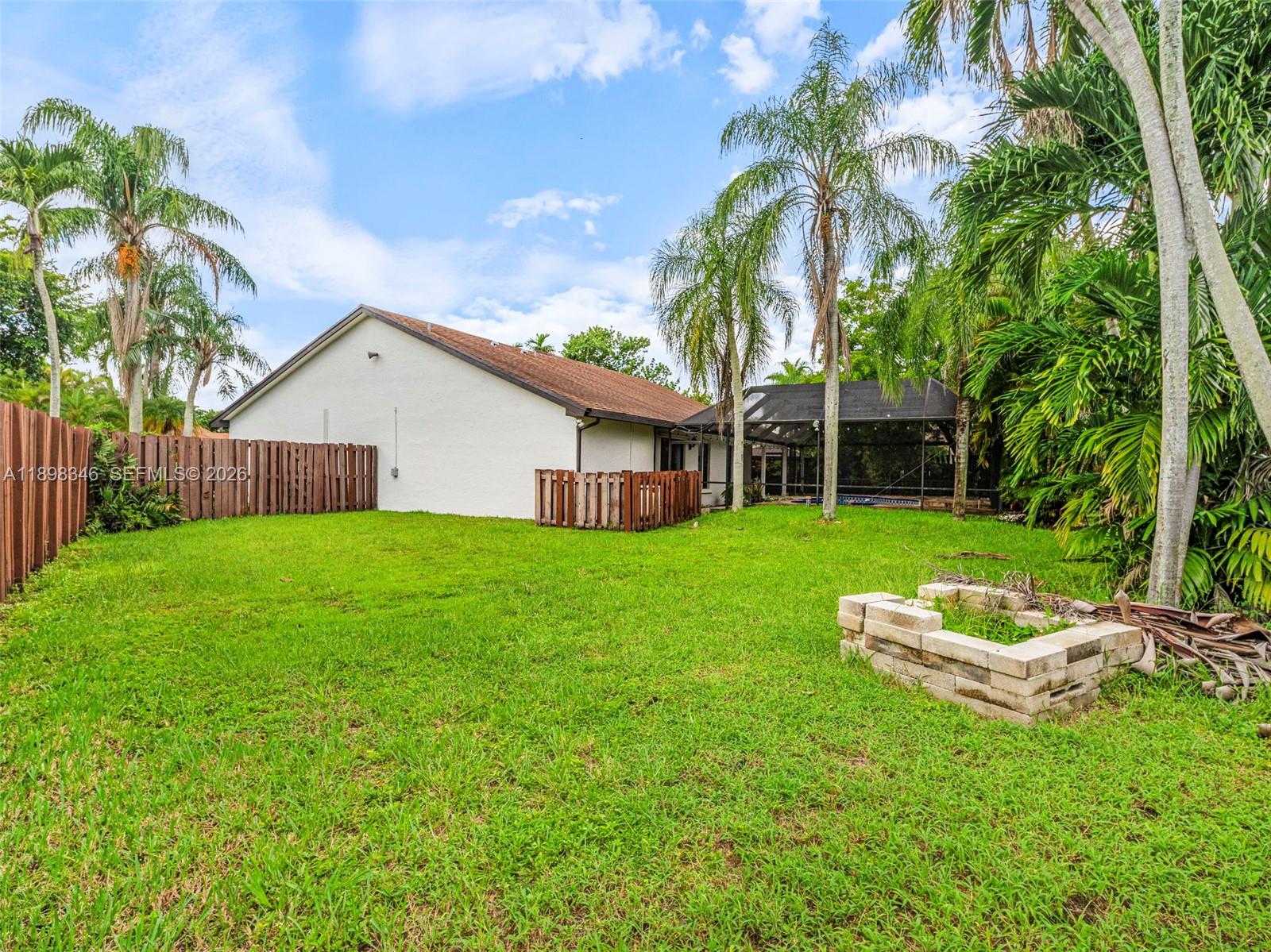 15531 Southwest 54th Terrace Miami, FL 33185 - Photo 46 of 61 a view of a house with a yard porch and sitting area