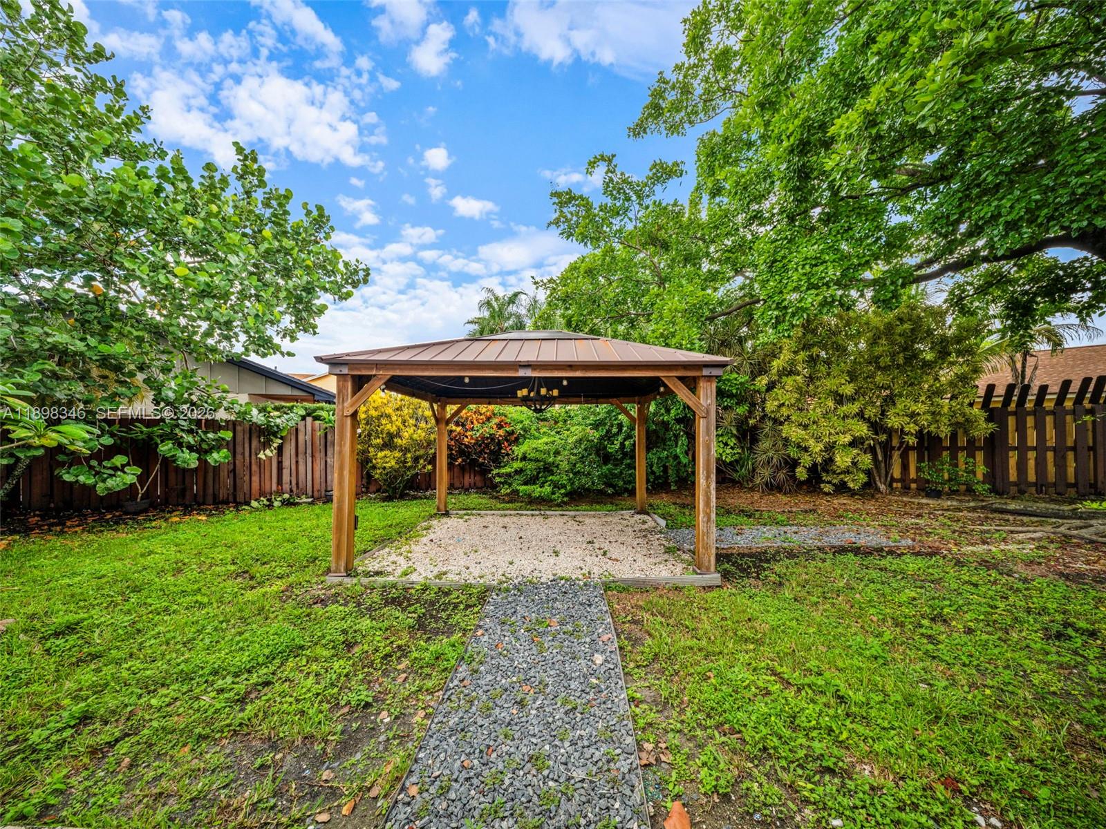 15531 Southwest 54th Terrace Miami, FL 33185 - Photo 49 of 61 a view of a backyard with a swing