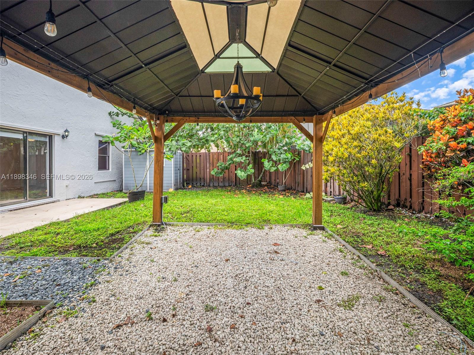 15531 Southwest 54th Terrace Miami, FL 33185 - Photo 52 of 61 a view of a porch with a backyard
