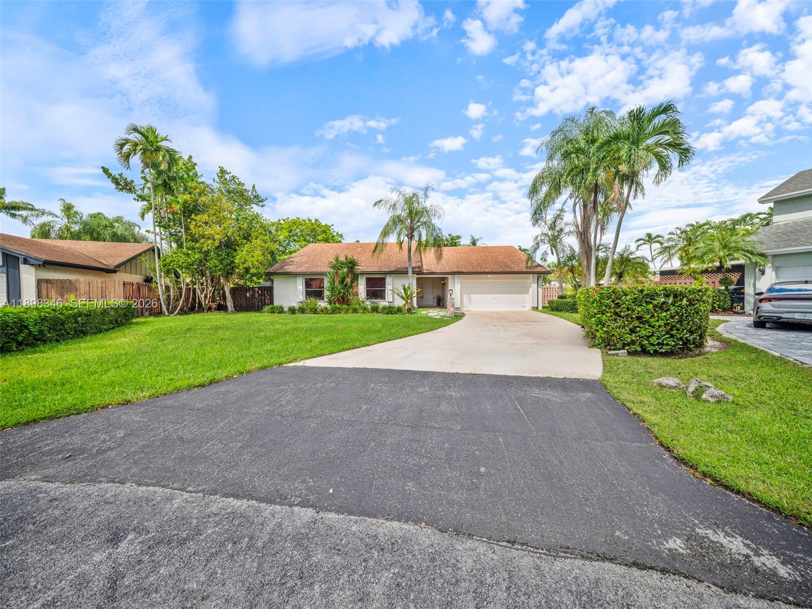 15531 Southwest 54th Terrace Miami, FL 33185 - Photo 53 of 61 a view of a garden with a houses