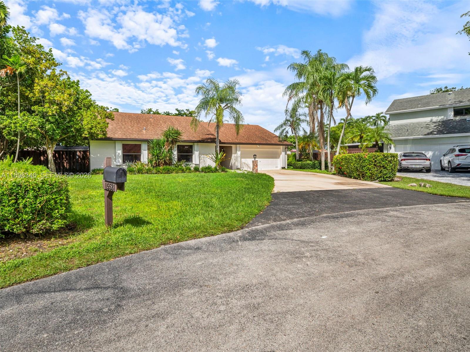 15531 Southwest 54th Terrace Miami, FL 33185 - Photo 54 of 61 a front view of a house with garden