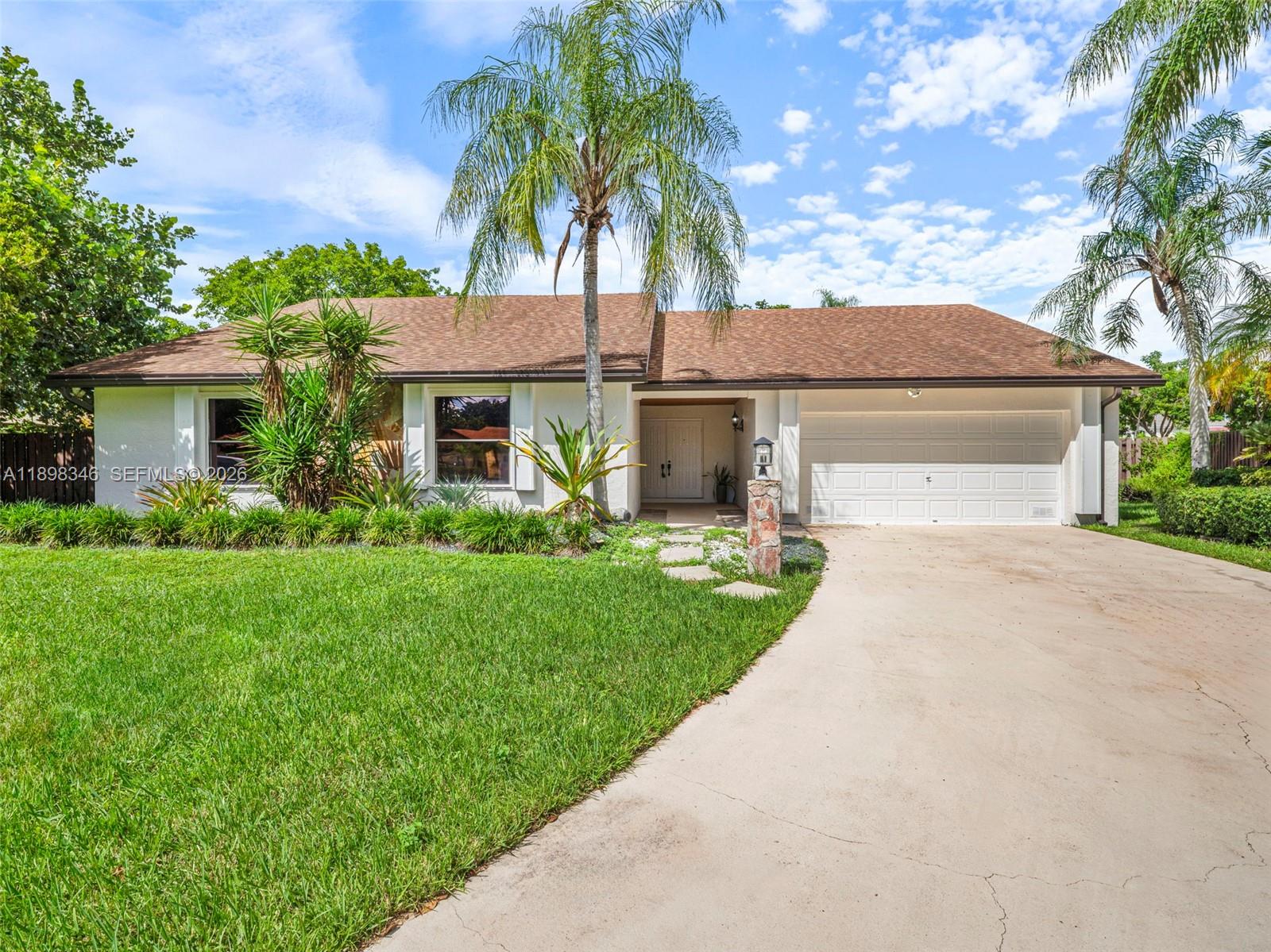 15531 Southwest 54th Terrace Miami, FL 33185 - Photo 56 of 61 a front view of house with yard and green space