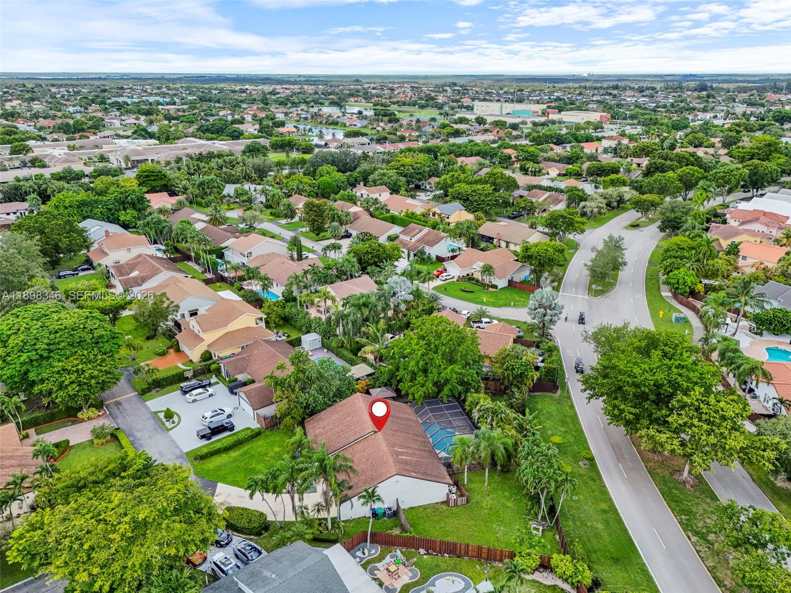 15531 Southwest 54th Terrace Miami, FL 33185 - Photo 58 of 61 an aerial view of residential houses with outdoor space and trees