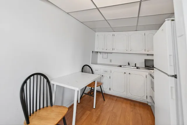 a view of a workspace with furniture