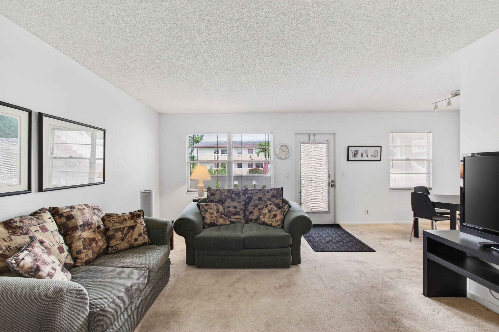 321 Fanshaw H Boca Raton, FL 33434 - Photo 22 of 92 a living room with furniture and a flat screen tv