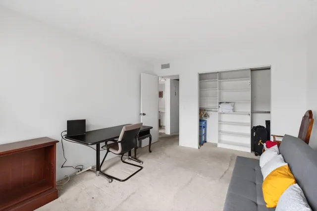 a workspace with furniture and window